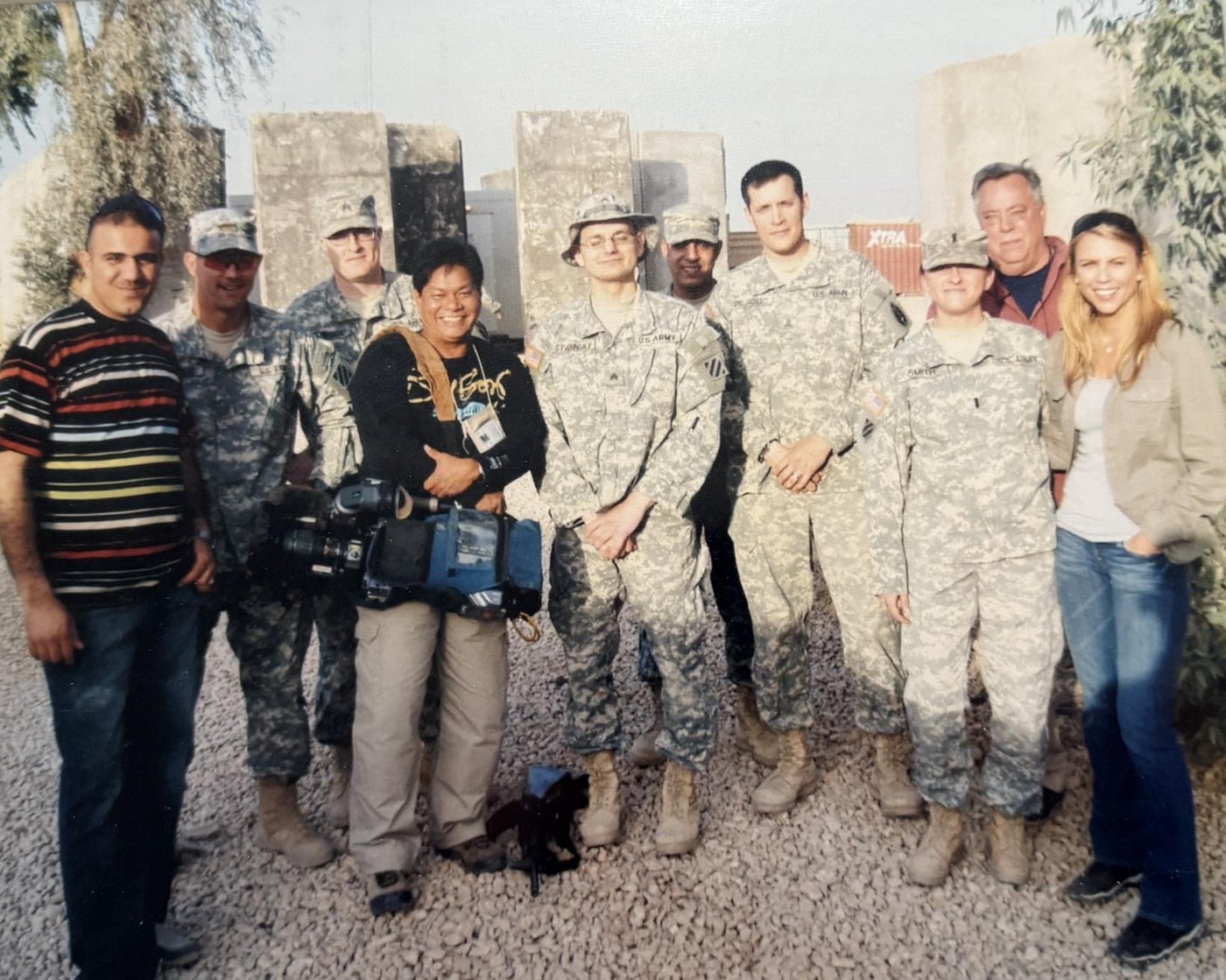 Kalen Marie Cotto with soldiers and a news crew at FOB Kalsu, Iraq